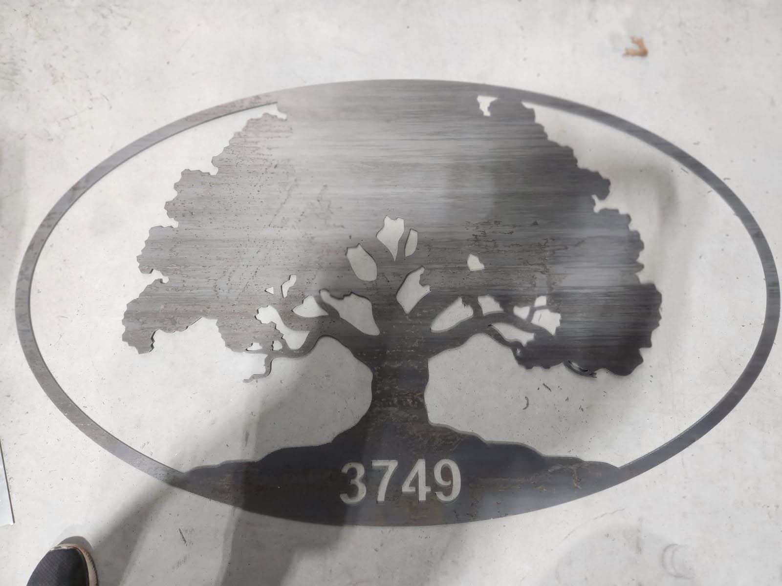 Oval plasma cut tree ranch sign with address numbers