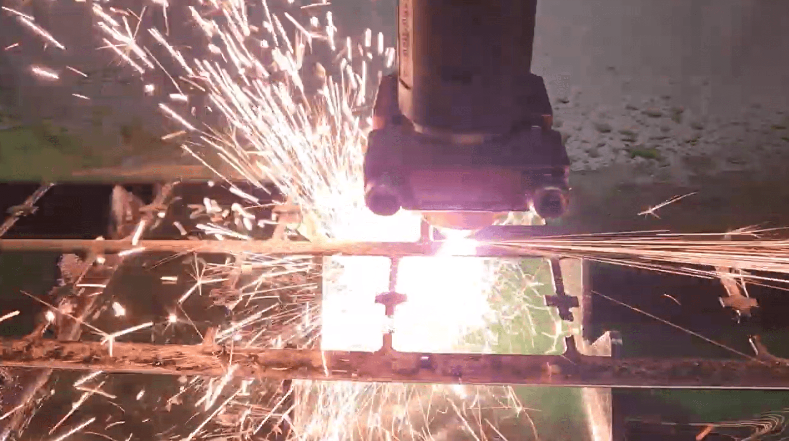 CNC plasma cutting steel with sparks in the CNC Powder shop